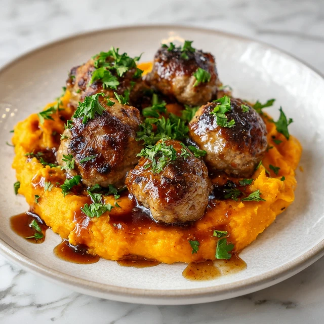 Savory Pork Meatballs over Sweet Potato Mash with Bourbon-Maple Drizzle